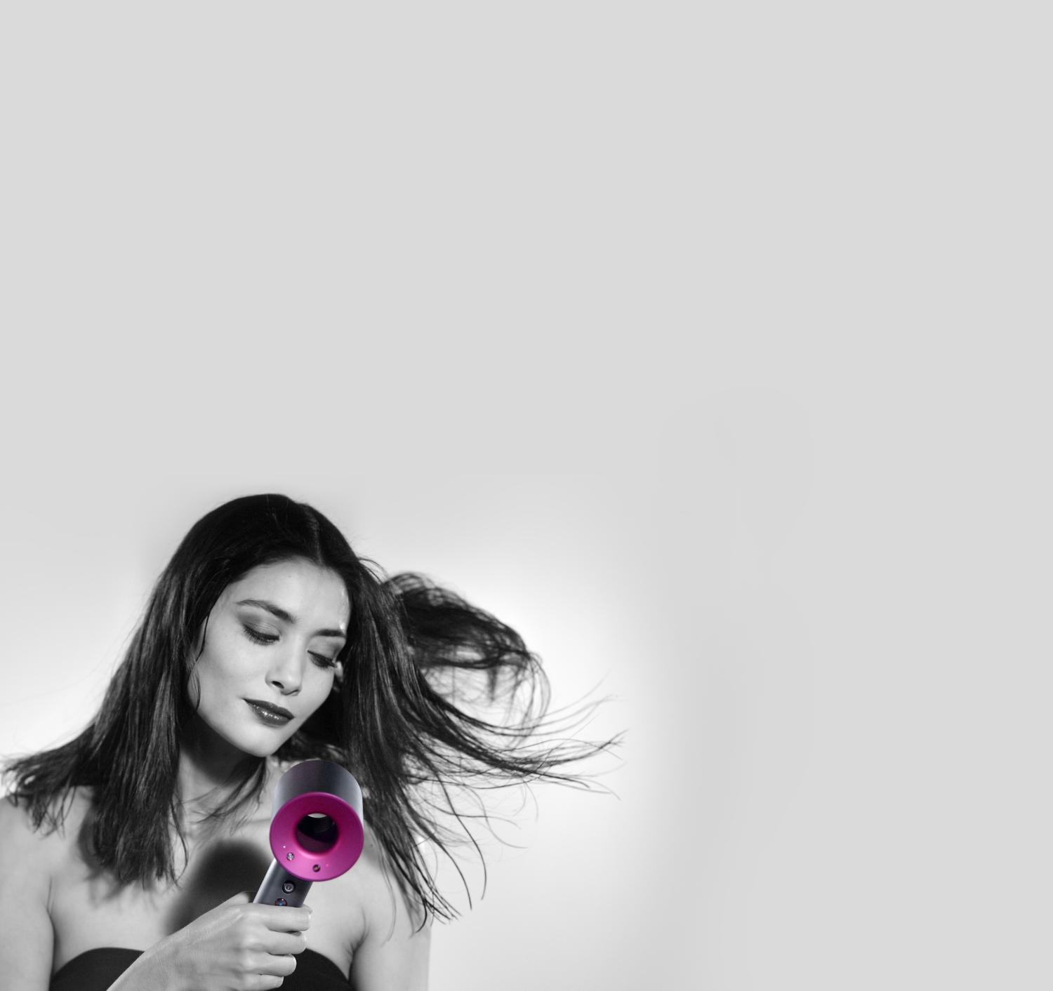 Model using Dyson Supersonic™ hair dryer